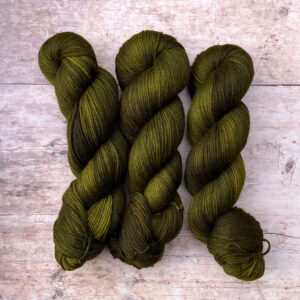 Three skeins of Plump DK in a deep, rich olive green