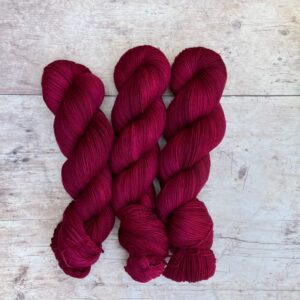 Three skeins of Classic Sock in a deep rich pink