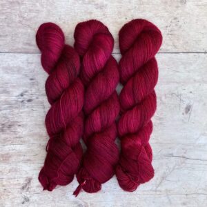 Three skeins of Merino Floof in a deep rich pink